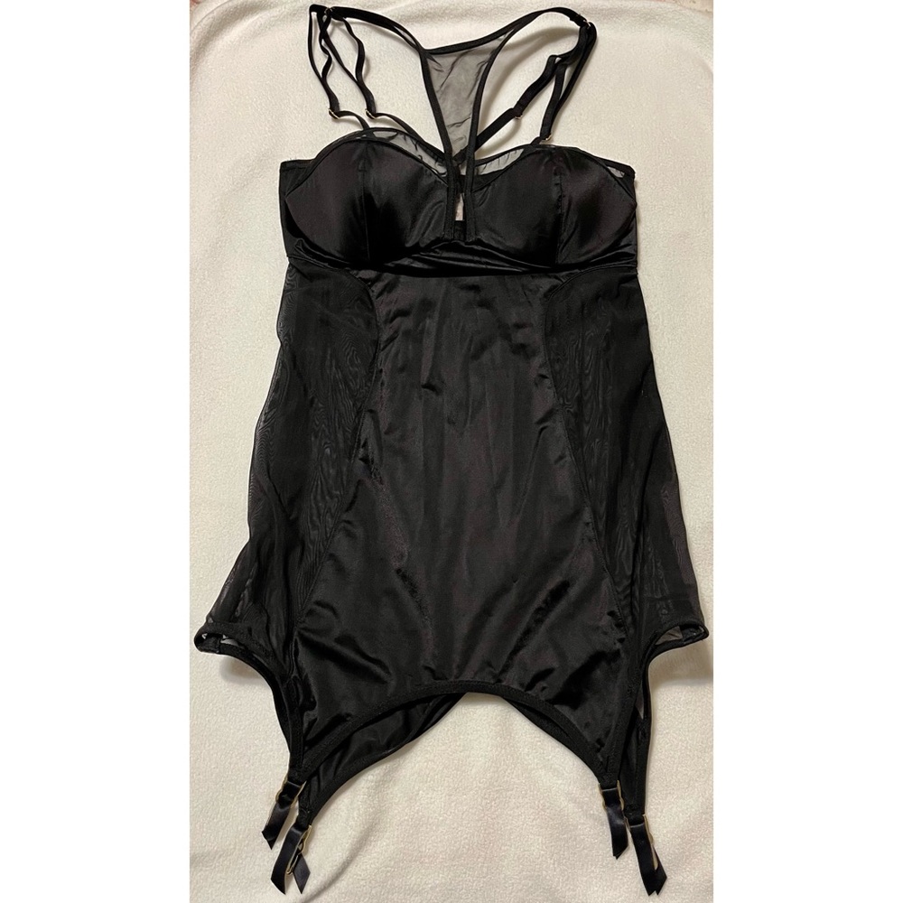 Black basque with high neck and mesh cutout detail